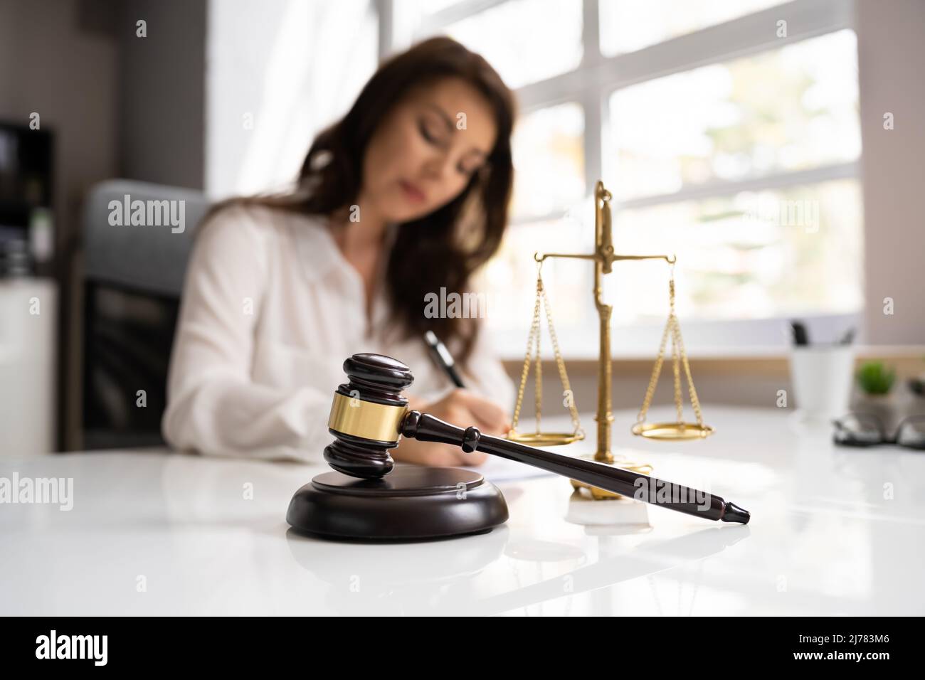 Female Lawyer In Courtroom At Litigation Trial Stock Photo