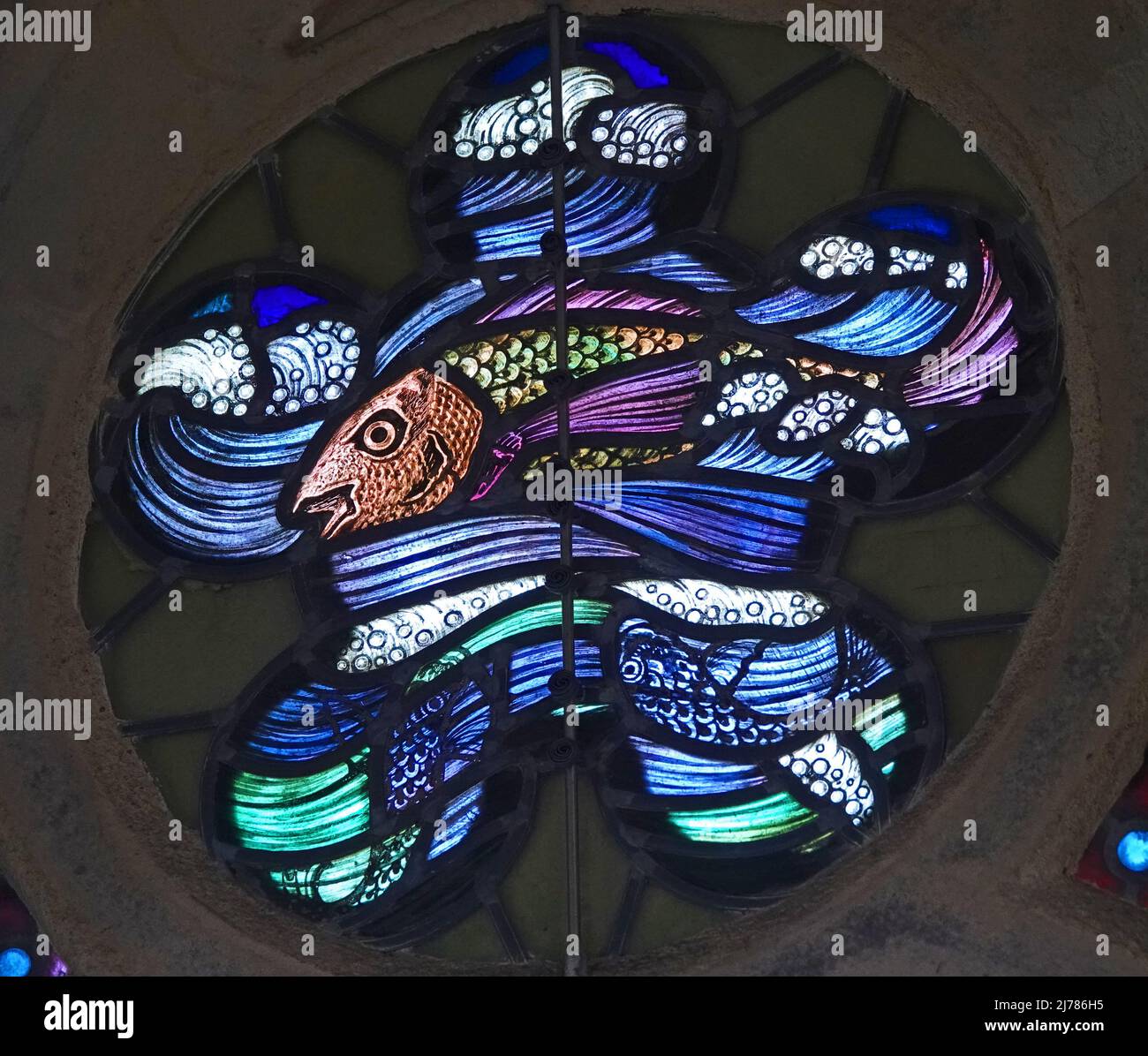 A detail of a beautiful stained glass window in an old manor. It's a ...