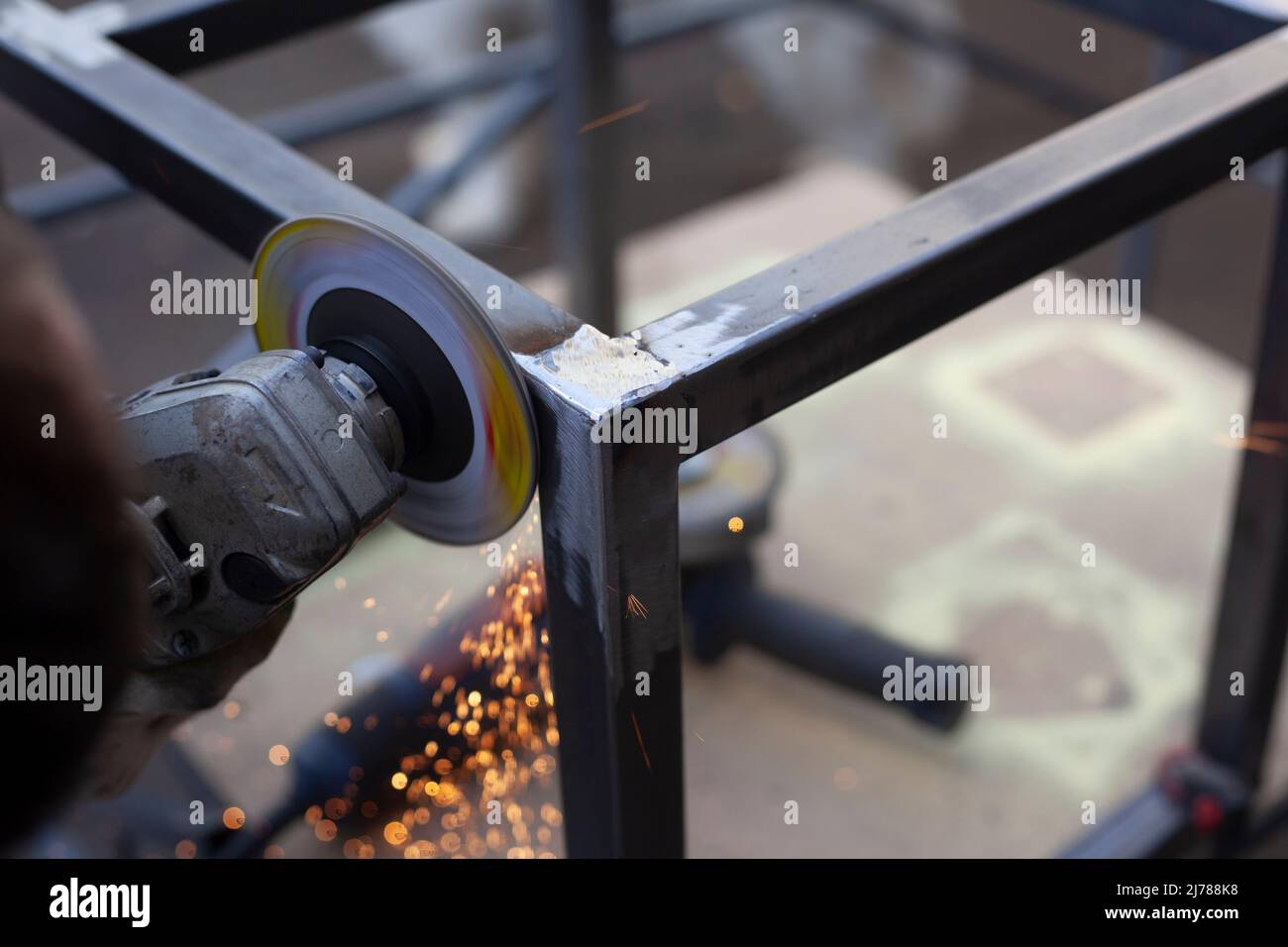 Corner grinding. Metal processing. Stripping of seams after welding