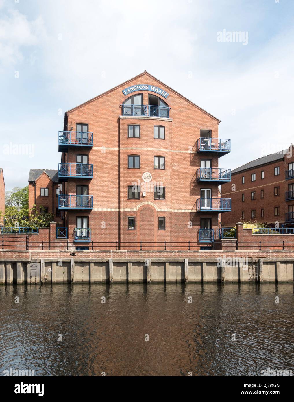 Langtons Wharf a riverside residential development alongside the river Aire in Leeds city centre, Yorkshire, England, UK Stock Photo