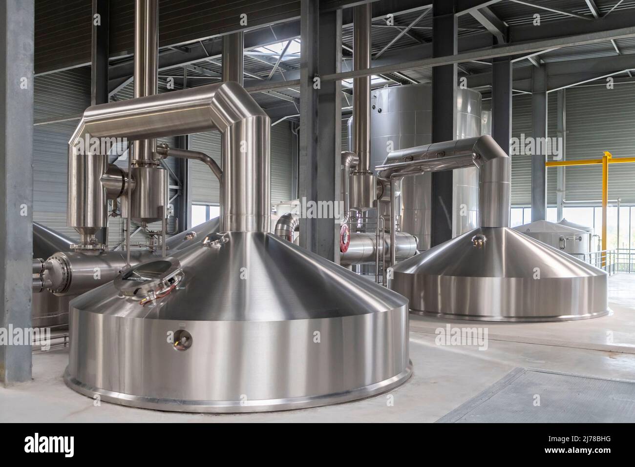 May 2, 2022, Arques, France, France: Arques, France May 2, 2022 - Production site of the Goudale brewery. The French brewery Goudale has just invested 25 million euros in its Arques plant in the Pas-de-Calais department. A new production line allows to pack 35 000 bottles per hour. ..BRASSERIE GOUDALE, ILLUSTRATION, GENERIQUE, USINE, SITE DE FABRICATION, ECONOMIE, HAUTS DE FRANCE, BIERE, PAS DE CALAIS, SAINT OMER, BOISSON, ALCOOL, BATIMENT INDUSTRIEL, EMPLOI, HOUBLON, CHAINE DE PRODUCTION, CEREALES, FERMENTATION, TRAVAIL, BIERES DE SPECIALITE, BRASSEUR, ACTIVITE BRASSICOLE, TRADITION, RECETTE, Stock Photo