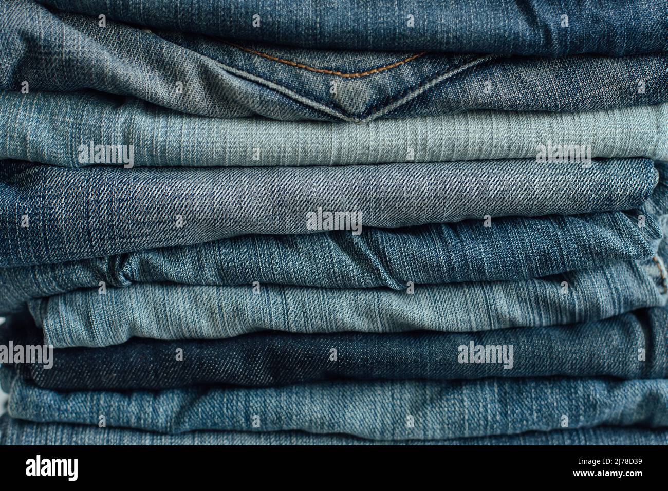 Stack of a stack of old jeans various shades of blue jeans. Denim jeans ...