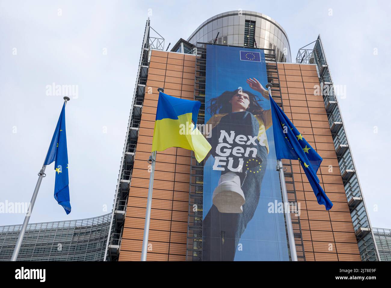BRUSSELS, Belgium -May 7, 2022: Ukrainian and European flags blowing in front of the seat of the European Commission Stock Photo