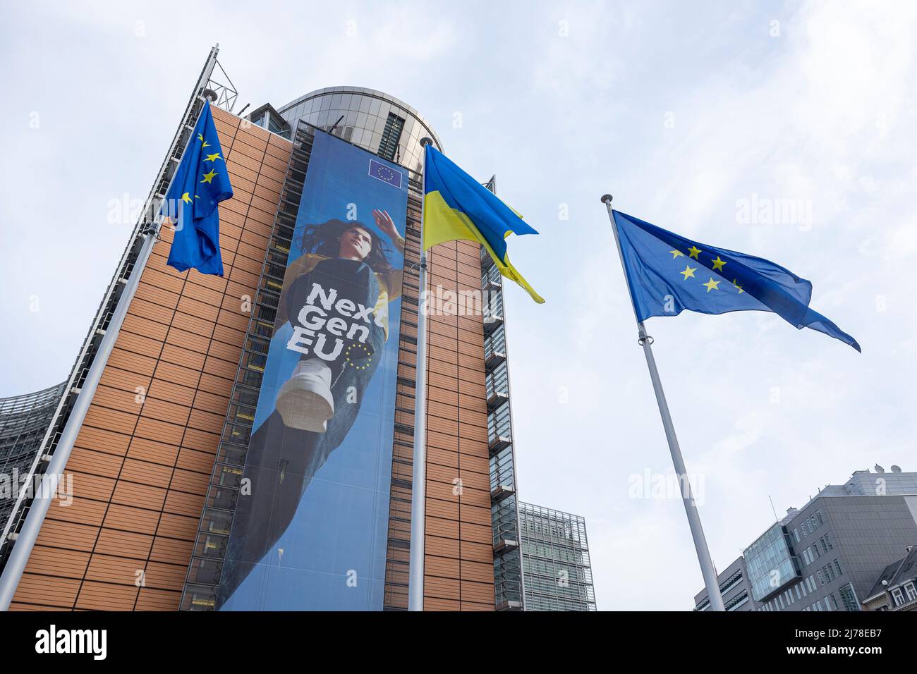 BRUSSELS, Belgium -May 7, 2022: Ukrainian and European flags blowing in front of the seat of the European Commission Stock Photo