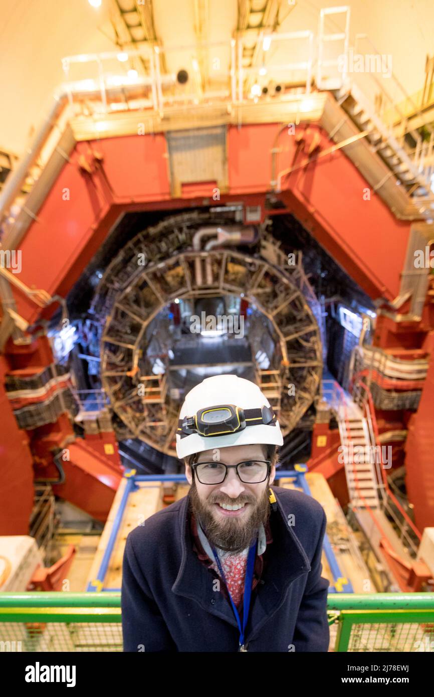 Norwegian scientist Arild Velure next to the ALICE detector on the LHC. ALICE is abbreviation of 'A Large Ion Collider Experiment'. The scientists and engineers at the CERN are gearing up for the next big chapter in the history of the world's biggest research lab. Plans are under way to build another particle collider that is four times larger than the existing LHC - Large Hadron Collider. Stock Photo