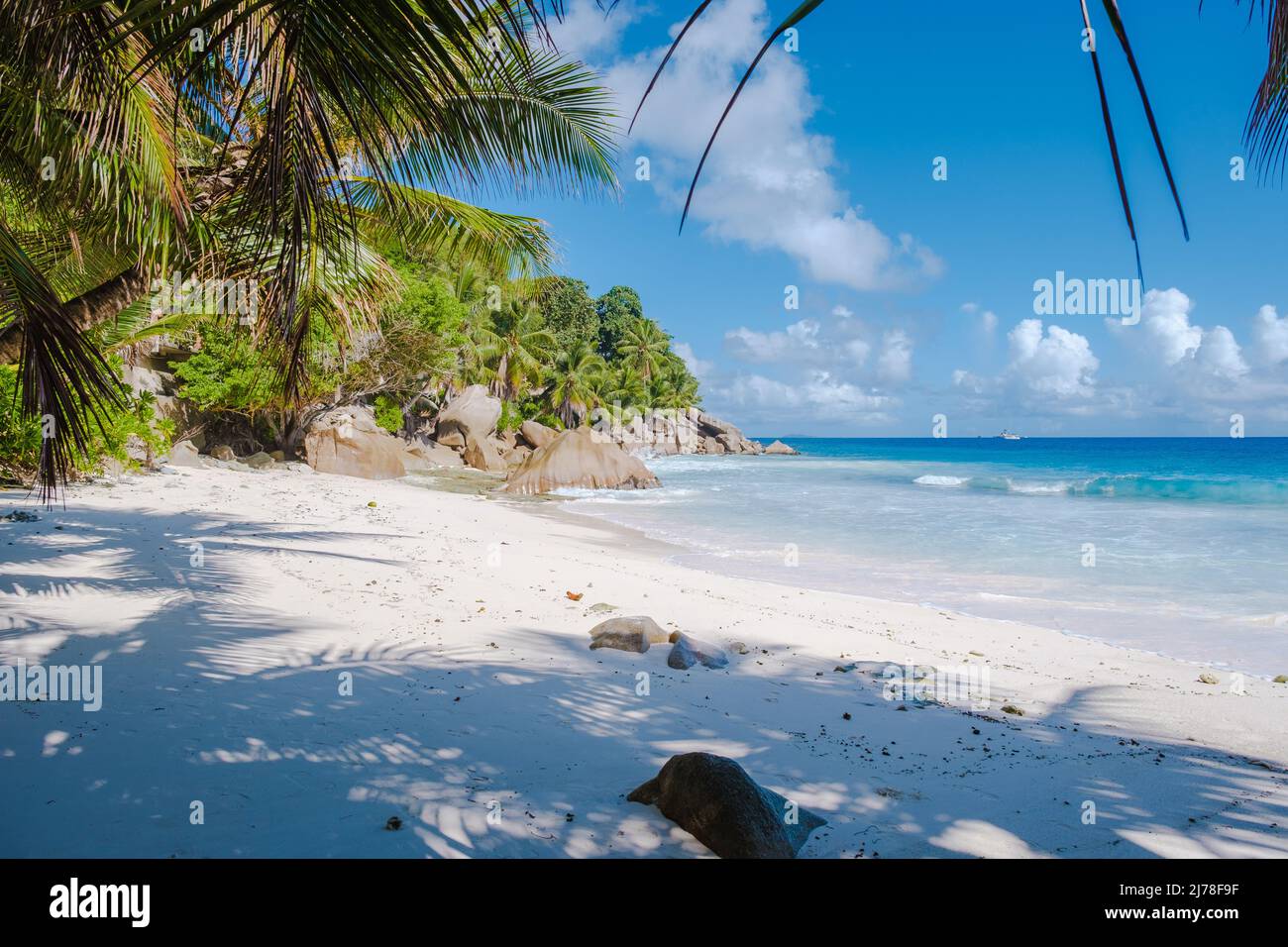Anse Patates beach, La Digue Island, Seychelles, white beach with blue