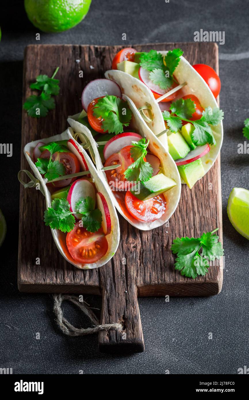 Tasty and vegetarian tacos with fresh vegetables and herbs. Mexican