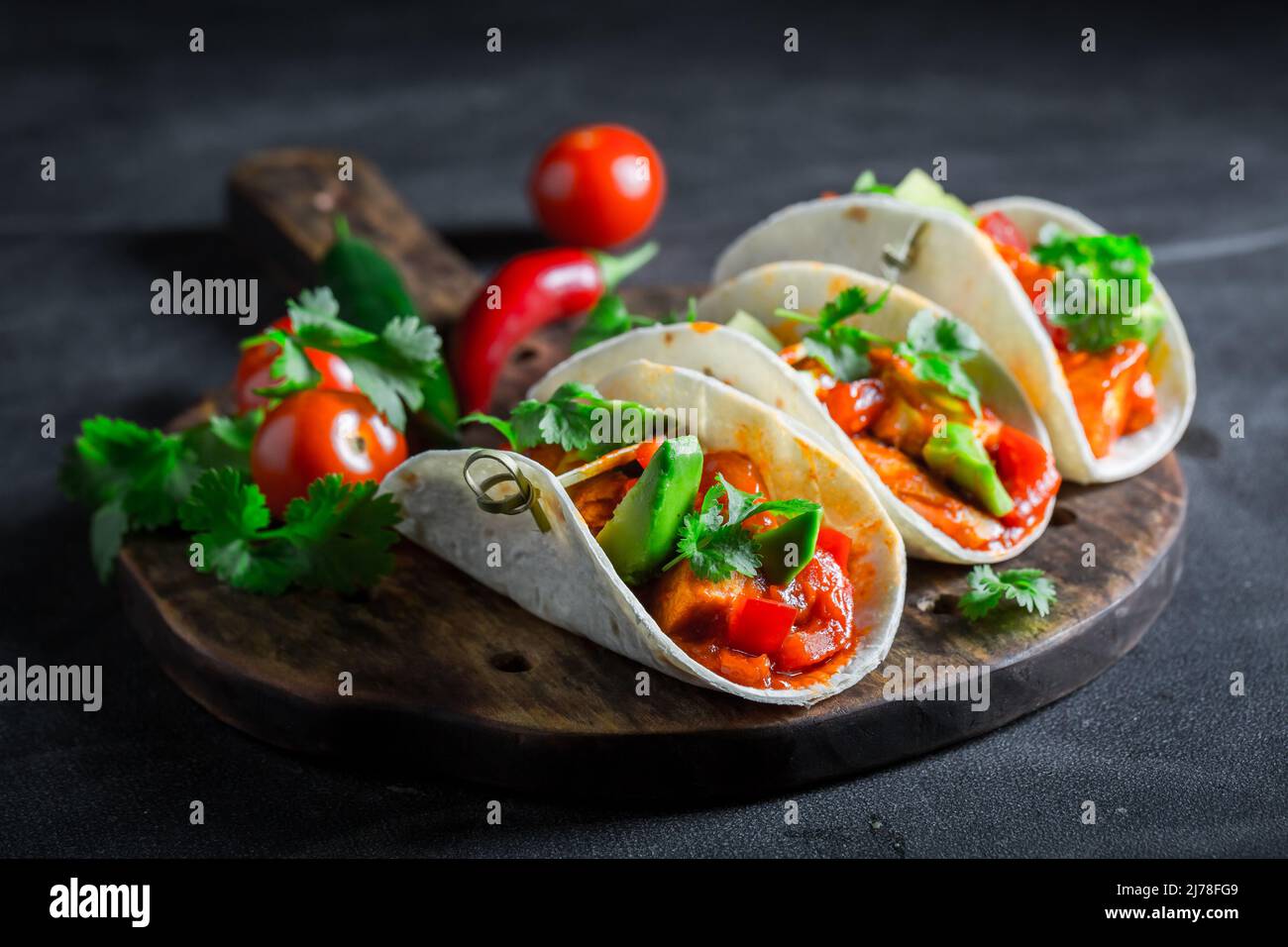 Tasty and vegetarian tacos as small colorful appetizer. Tacos with