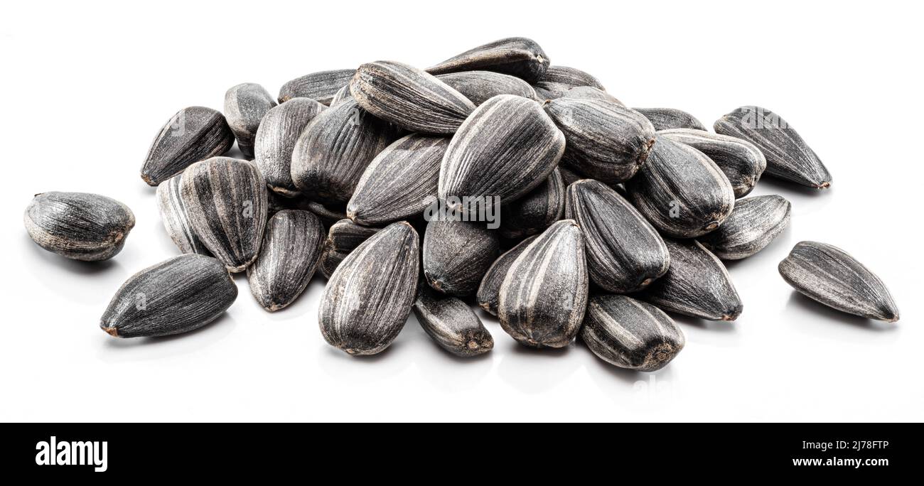 Pile of whole sunflower seeds isolated on white background Stock Photo ...