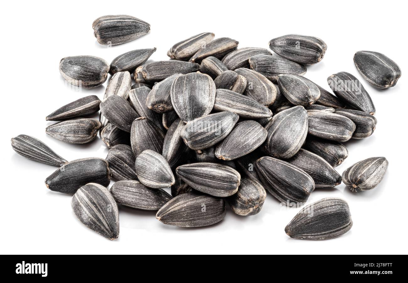Pile of whole sunflower seeds isolated on white background Stock Photo ...