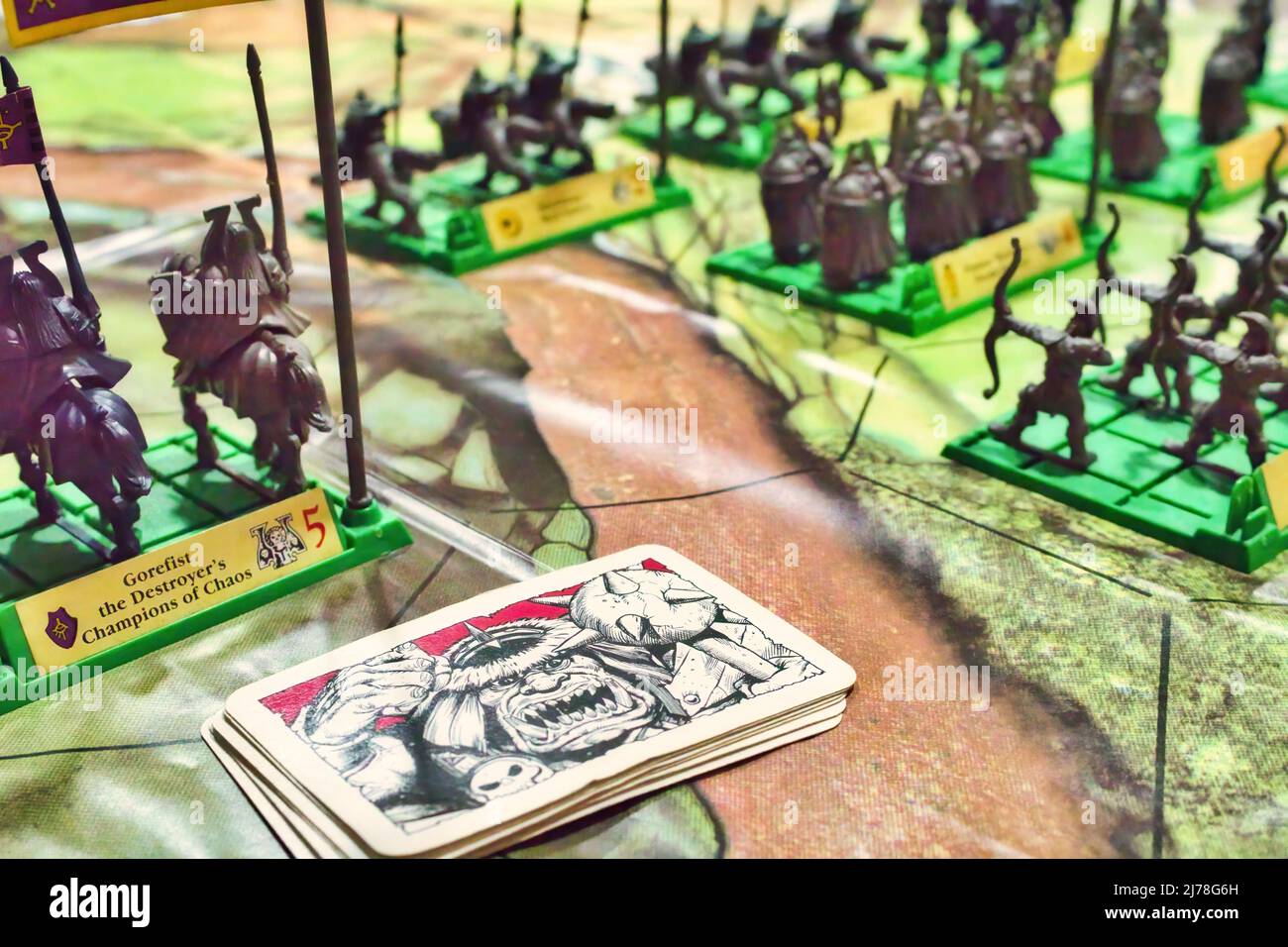 Close-up of Battle Masters strategy board game with playing cards and plastic model miniature fantasy soldiers Stock Photo