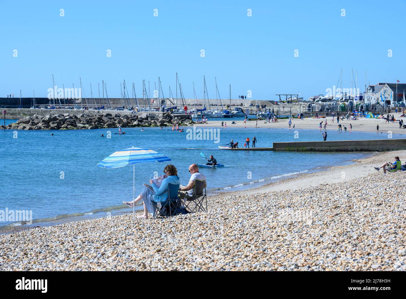 Lyme Regis, Dorset, UK. 7th May 2022. UK Weather Locals and visitors