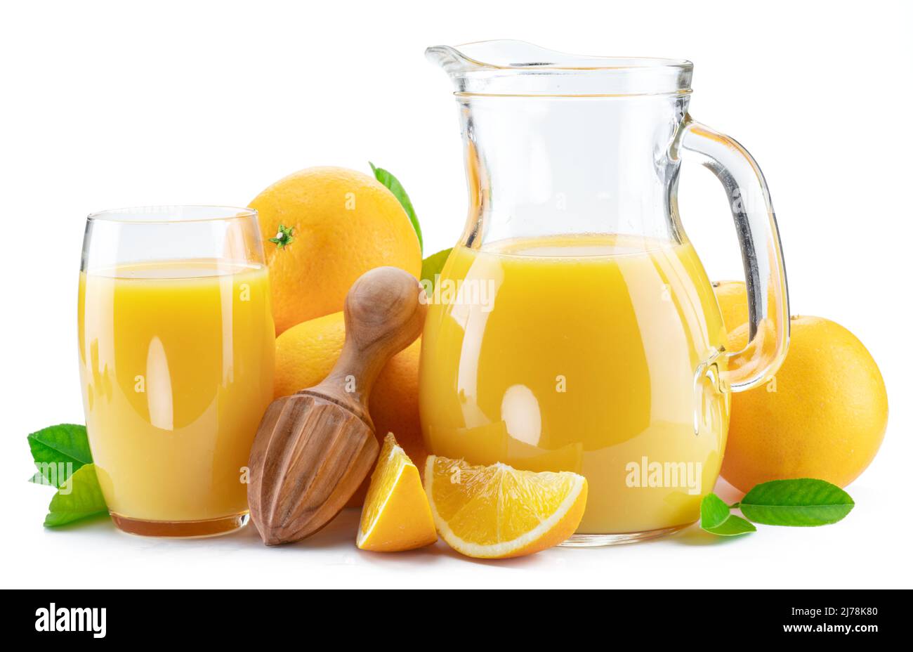 Yellow orange fruits and carafe of fresh orange juice isolated on white
