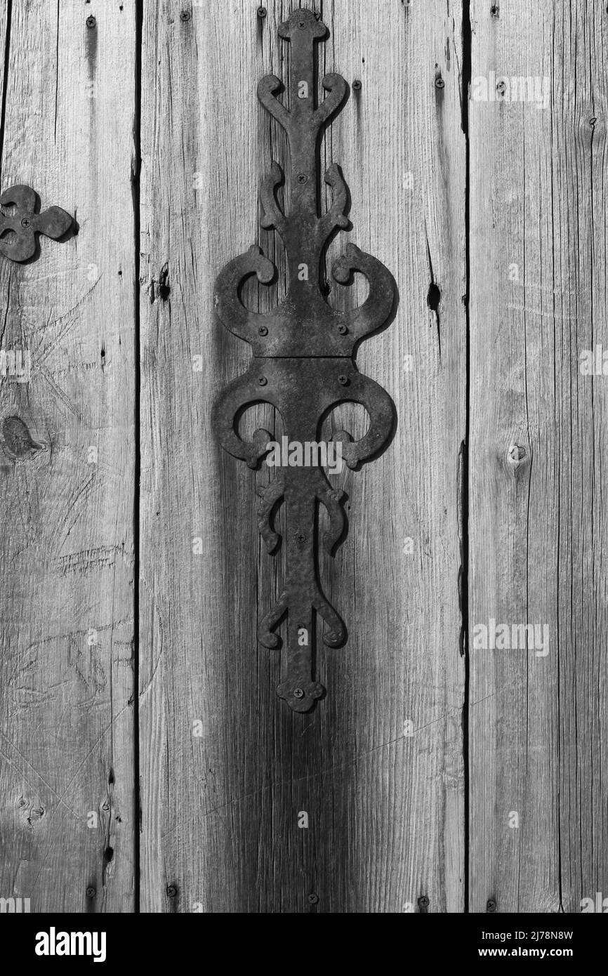 Vintage worn wooden door in black and white. Stock Photo