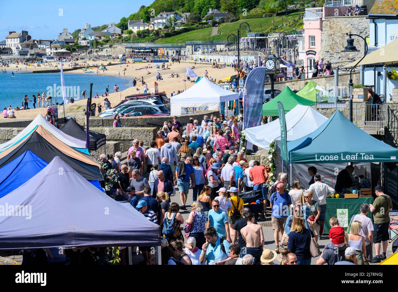 Lyme Regis, Dorset, UK. 7th May 2022. UK Weather People flock to the