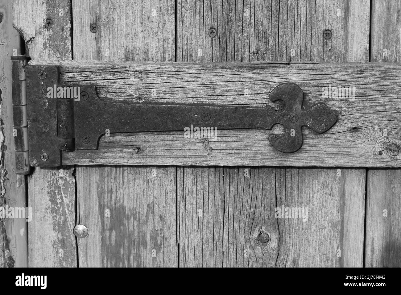 Vintage worn wooden door in black and white. Stock Photo