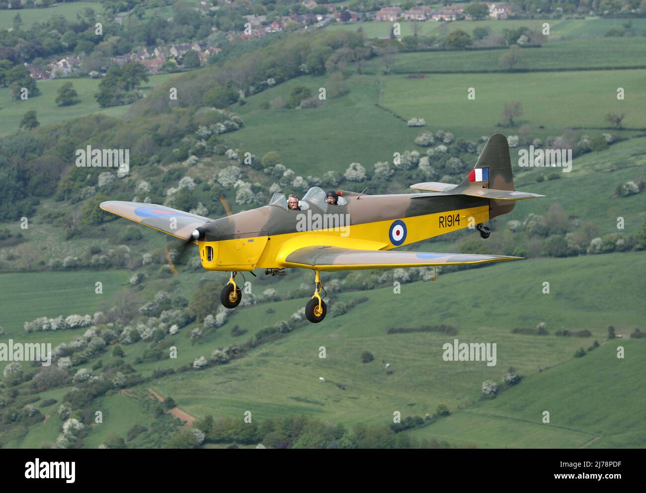 Air 2 Air photograph of the rare Miles Magister, also known as a Miles Hawk Trainer, over the Gloucestershire countryside. 1 of only 5 airworthy. Stock Photo