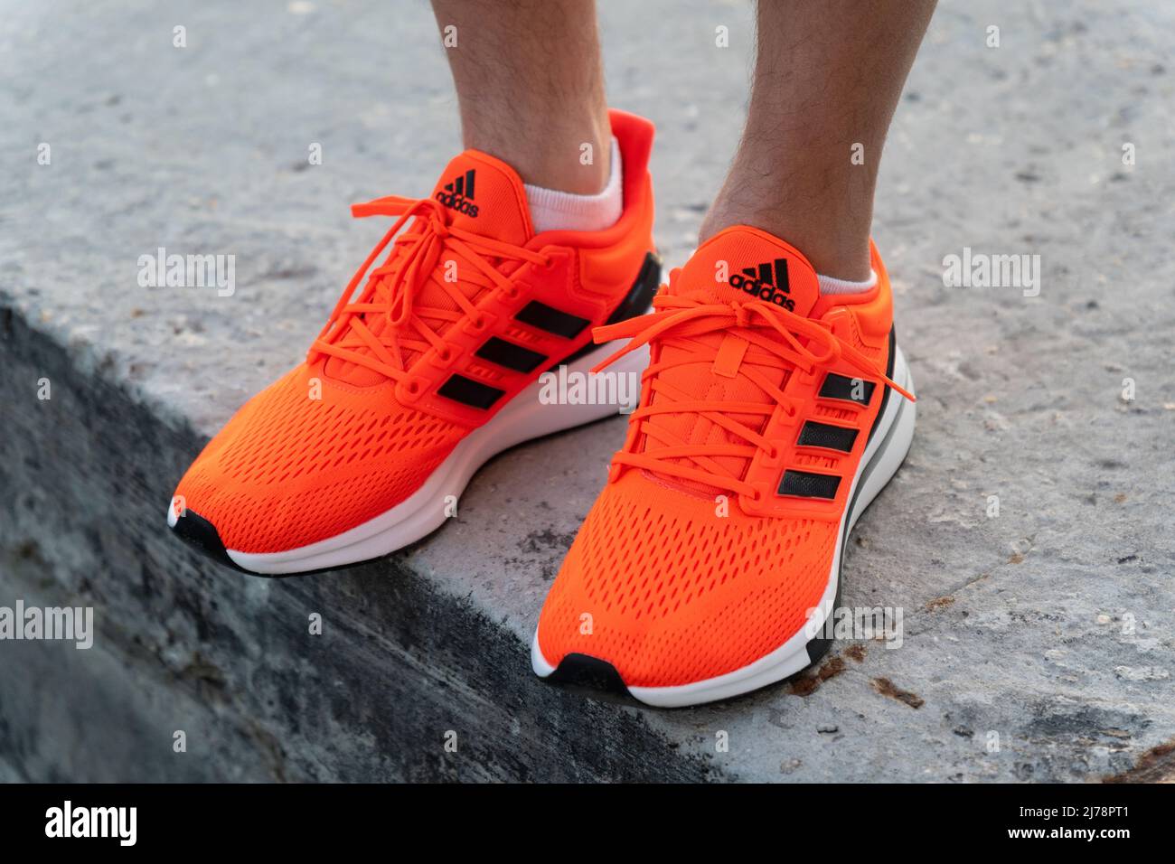 Tyumen, Russia-May 03, 2022: Adidas logo and shoes. Adidas is a German  multinational corporation that designs and manufactures shoes Stock Photo -  Alamy