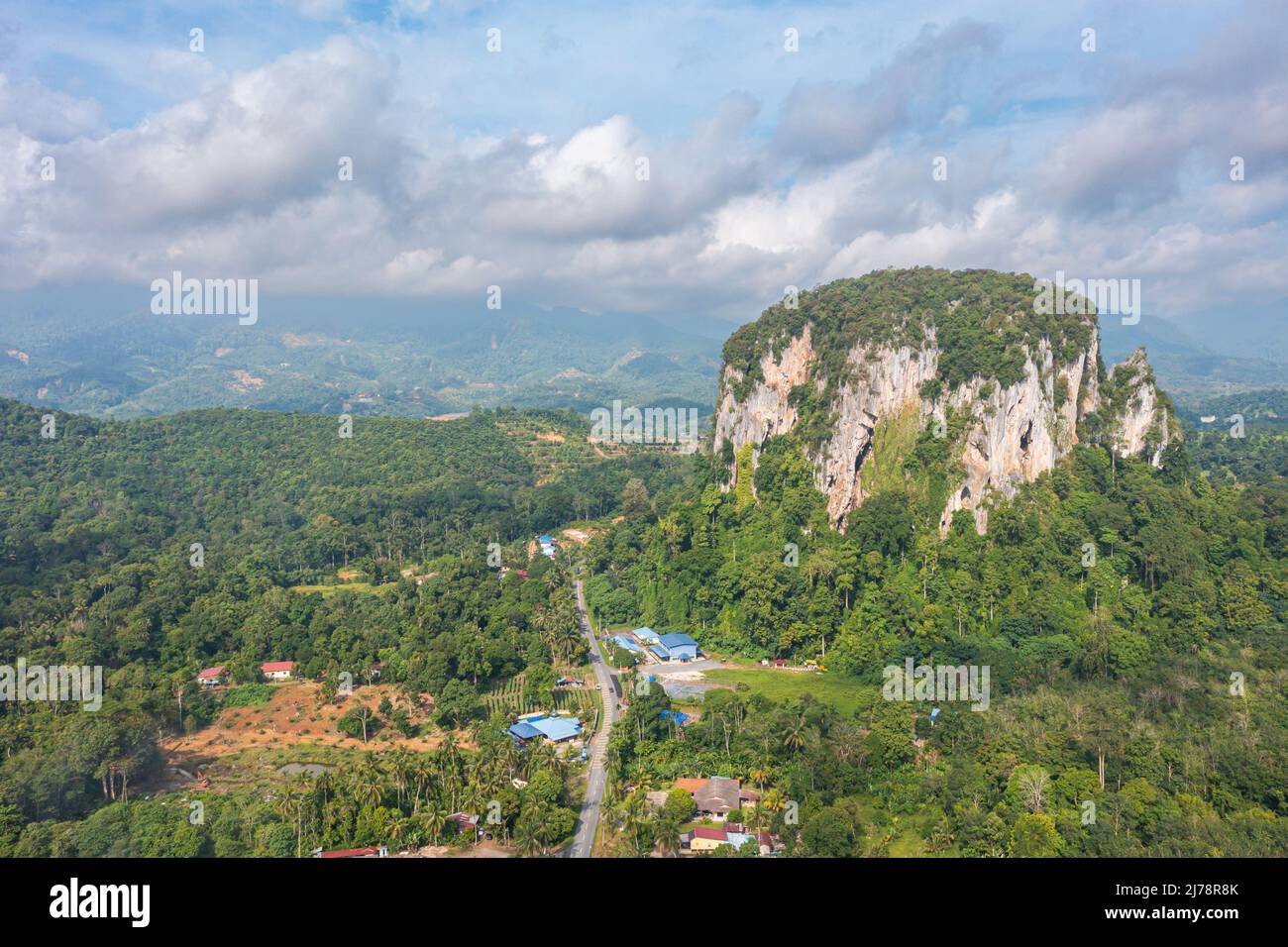 Aerial view to the Limestone hill  Bukit Batu Kapur at Cinta Manis, Pahang, Malaysia. A mountain rock out of nowhere in the middle of the Malaysian ra Stock Photo