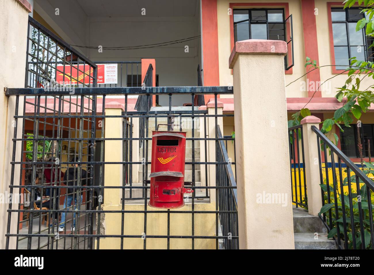 isolated indian postbox hanging at iron pole at post office from front angle Stock Photo