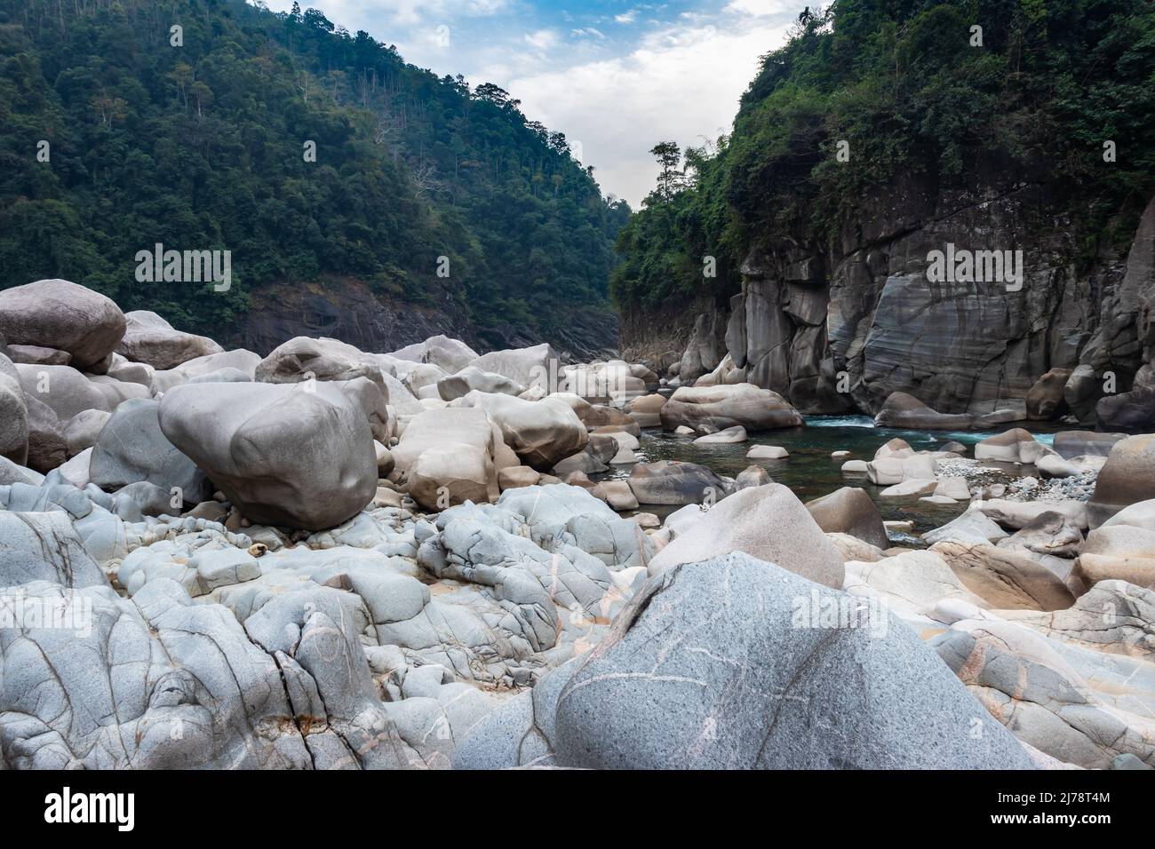 naturally formed white shiny stone in unique shape at dry river bed at morning from flat angle image is taken at Sliang wah Umngot amkoi jaintia hill Stock Photo