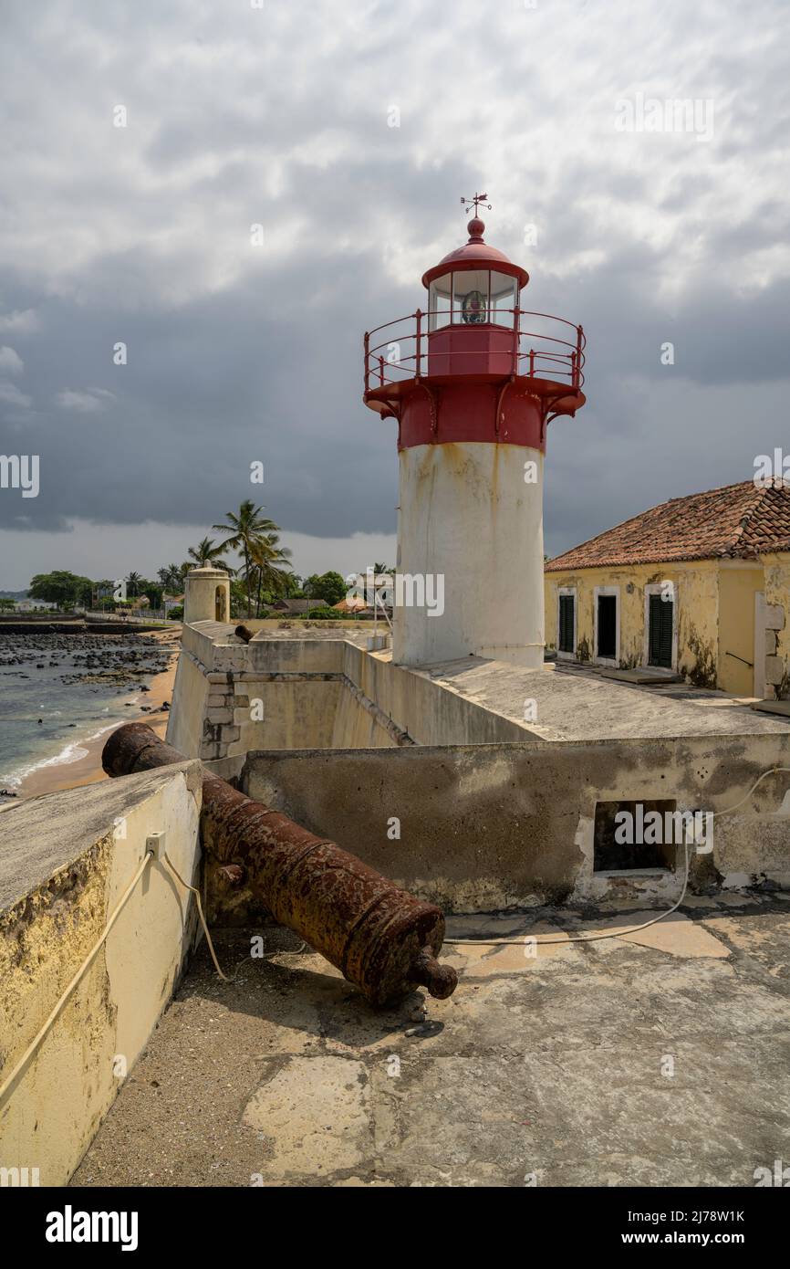 Cannon and lighthouse in the fort of Sao Sebastiao, today the National Museum of Sao Tomé and Principe. Stock Photo