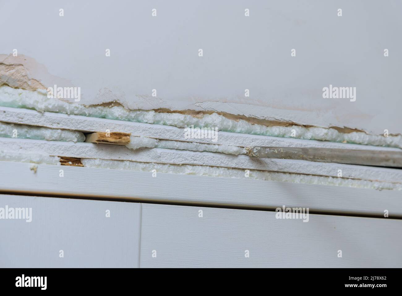 Master installs the interior door using polyurethane foam to mounting