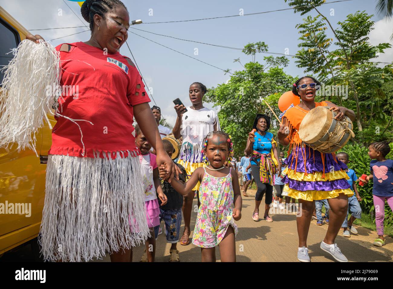Children and teachers dancing through the streets of Picao during the celebration of the school carnival. Stock Photo