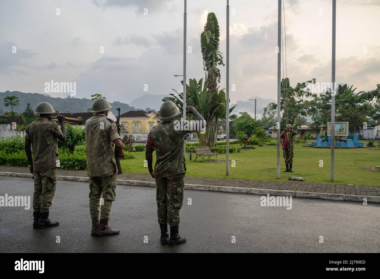 Soldiers lowering the flag of Sao Tomé e Principe during the traditional daily sunset ceremony. Stock Photo
