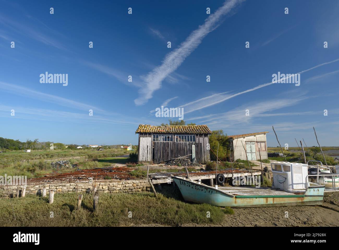 Oyster farming boat and rustic fishing hut at Fort Royer, Oleron Island, on Atlantic coast of Charente Maritime, France Stock Photo