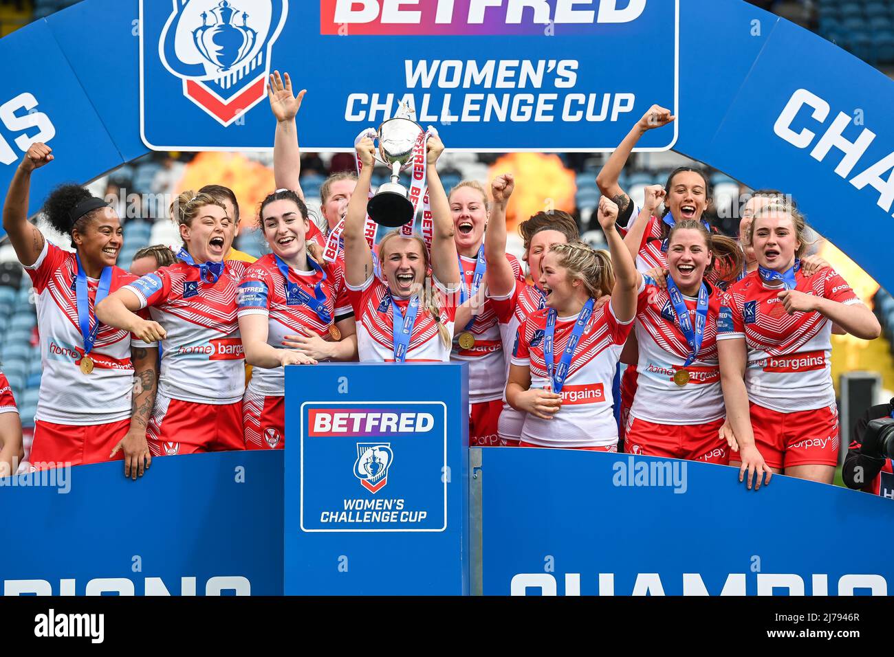Jodie Cunningham of St. Helens lifts the trophy in celebration of