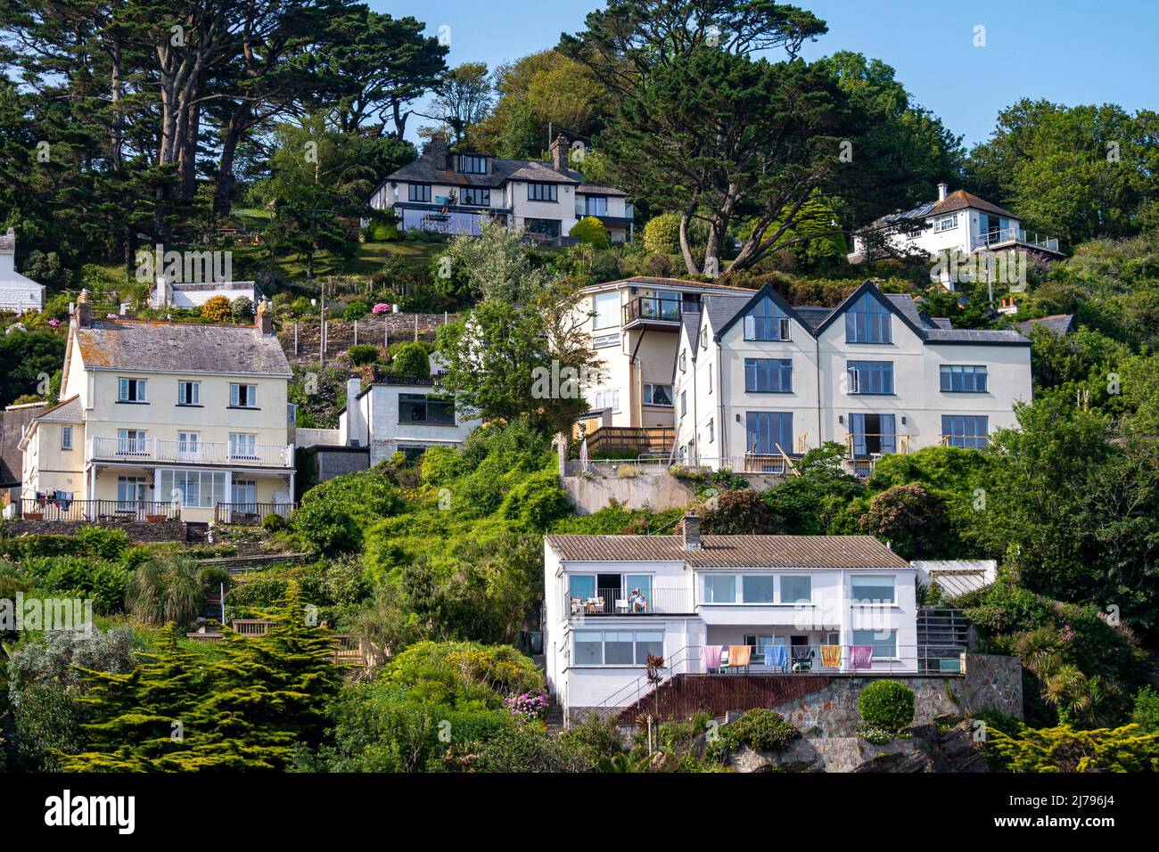 Hillside properties overlooking the harbour at Polperro, southern Cornwall, UK. Stock Photo