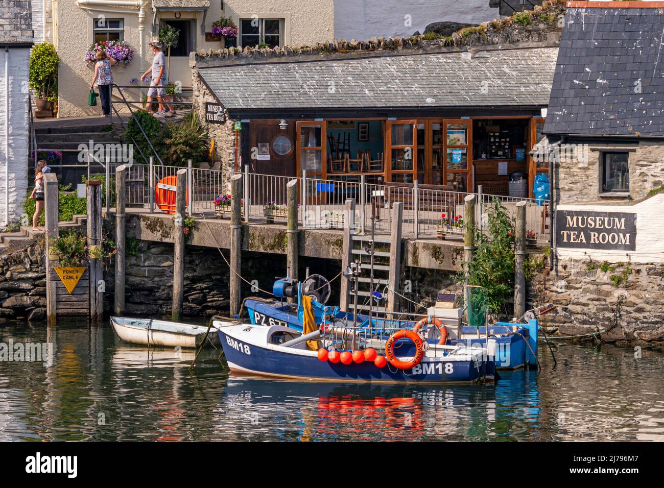 Polperro inner Harbour featuring the Heritage Museum, on a hot July day - Polperro, Cornwall, UK. Stock Photo