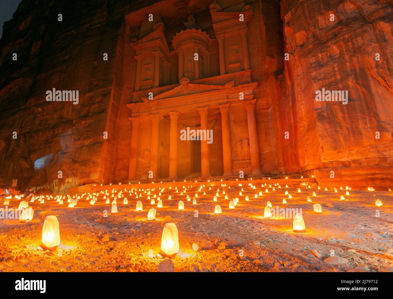 Petra by night (candlelit) and the Treasury monument (Al-Khazneh) in Petra archaeological site, Jordan. Stock Photo