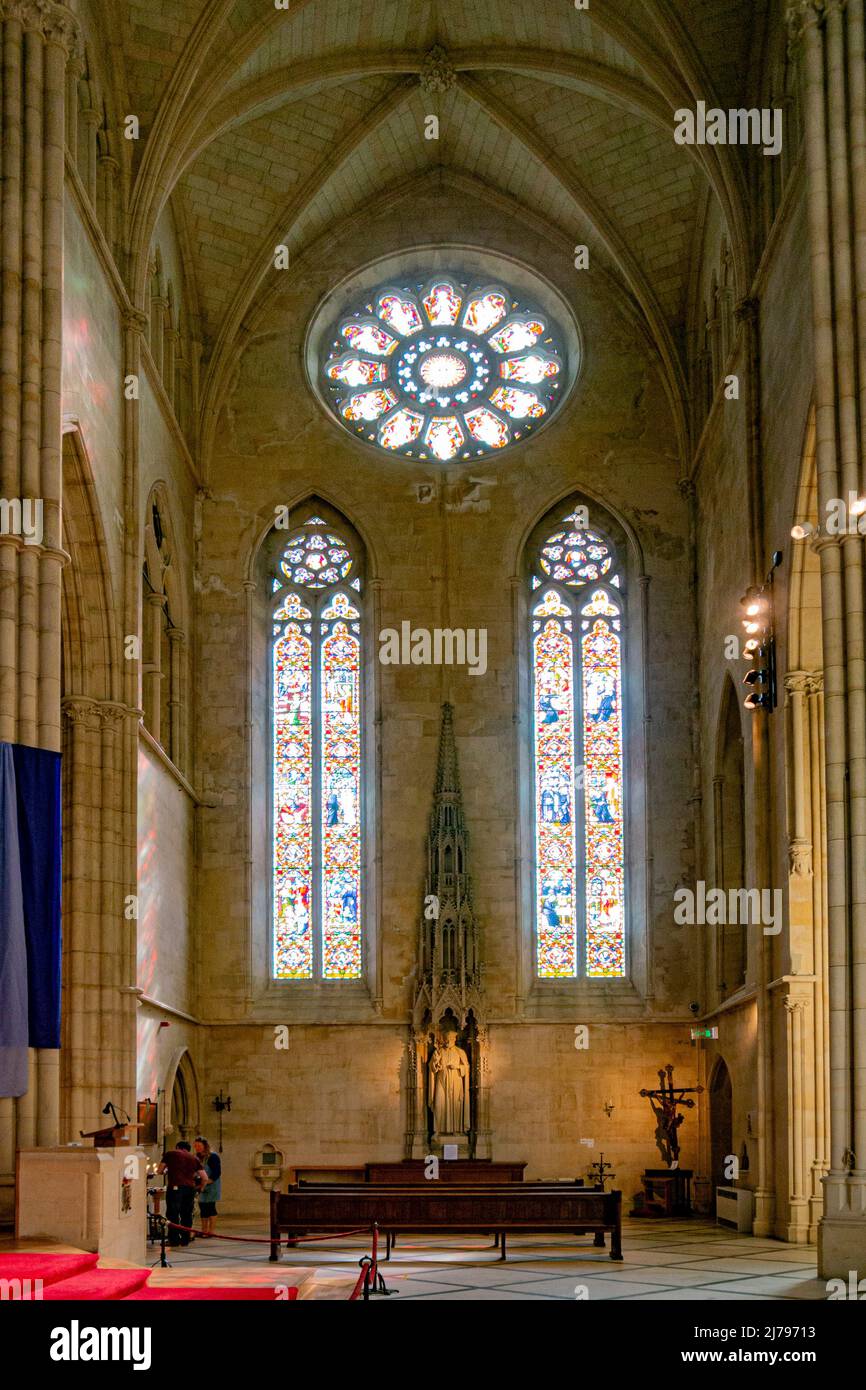 Inside Arundel Cathedral - here pictured with stunning architecture are three of the stained glass windows - Arundel, West Sussex, southern England. Stock Photo