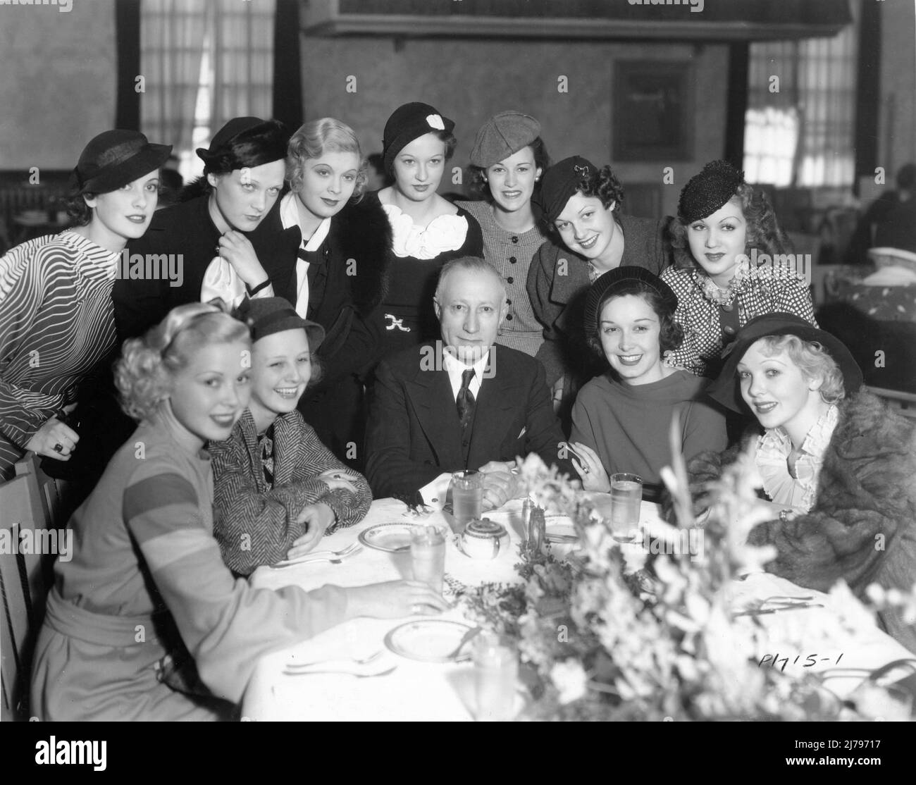 Founder of Paramount Pictures ADOLPH ZUKOR at an early 1934 luncheon at Paramount Studios in his honour surrounded by young contract actresses with at table from left TOBY WING, CHARLOTTE HENRY, GAIL PATRICK and IDA LUPINO and standing from left GWENLLIAN GILL, BARBARA FRITCHIE, DOROTHY DELL, EVELYN VENABLE, ELIZABETH YOUNG, CLARA LOU (later ANN) SHERIDAN and GRACE BRADLEY Stock Photo