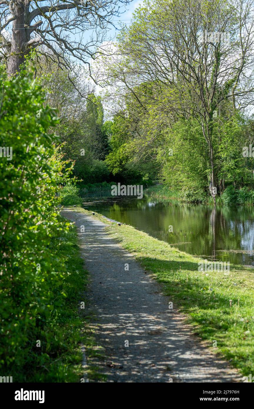 Looking along the towpath of the Montgomery Canal in the spring sunshine Stock Photo