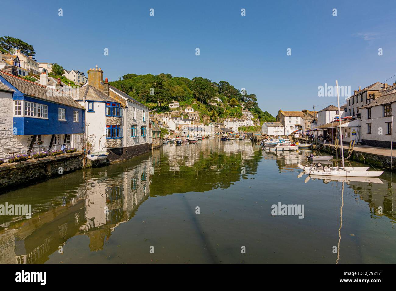 Polperro inner harbour at high tide on a hot July day - Polperro, Cornwall, UK. Stock Photo