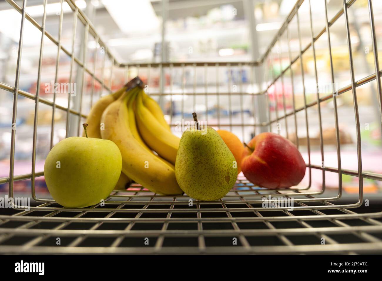 Fruits inside in trolley in supermarket, Inflation and economic recession concept. Stock Photo