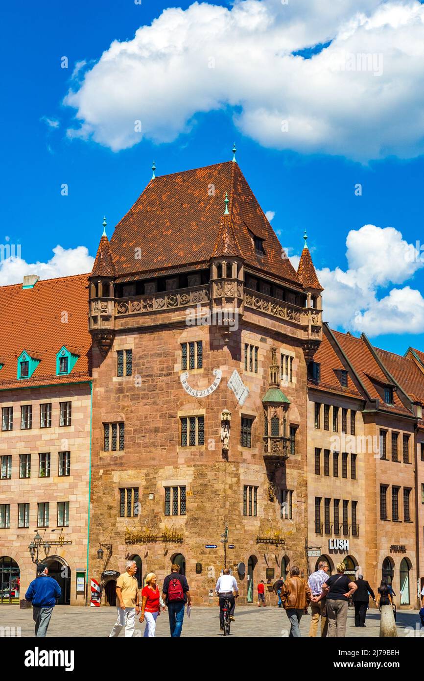 Great view of the famous Nassauer Haus or Schlüsselfeldersche Stiftungshaus in Nürnberg, Germany. The medieval residential tower or fortified tower... Stock Photo