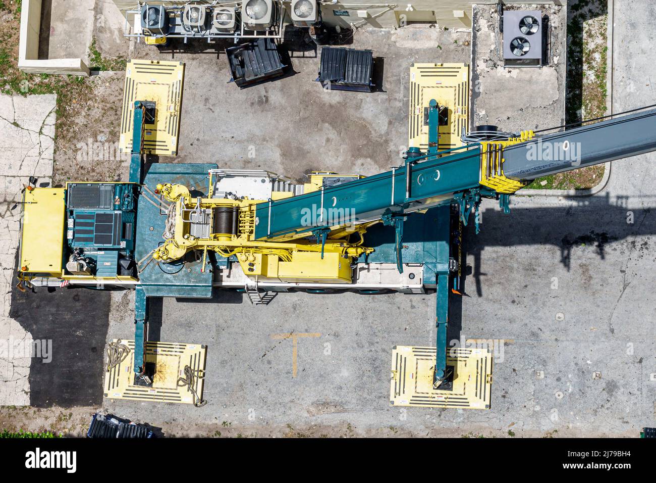 Miami Beach Florida construction lifting crane looking down mats pads