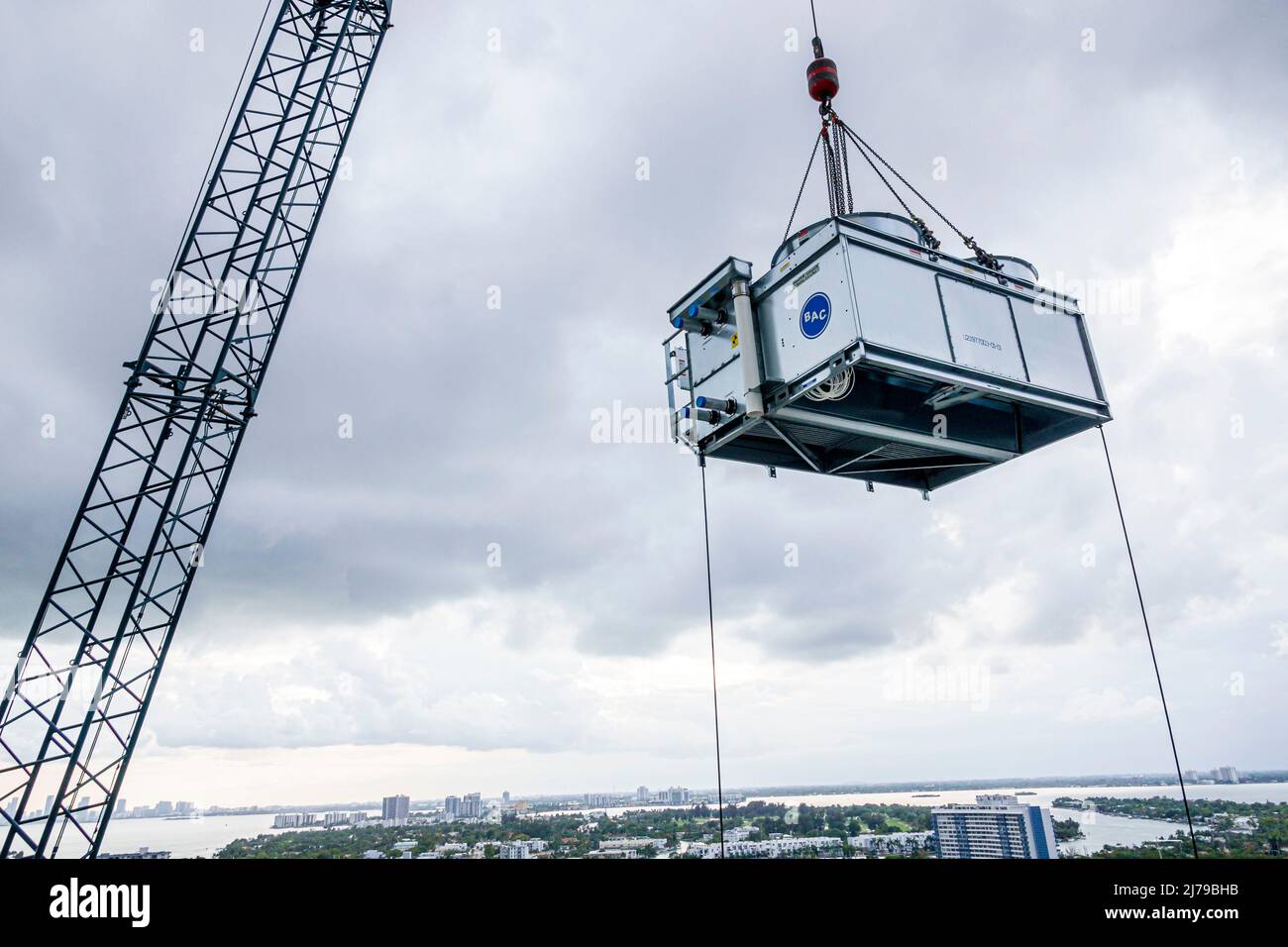 Miami Beach Florida construction lifting crane HVAC AC air conditioner cooling tower Stock Photo