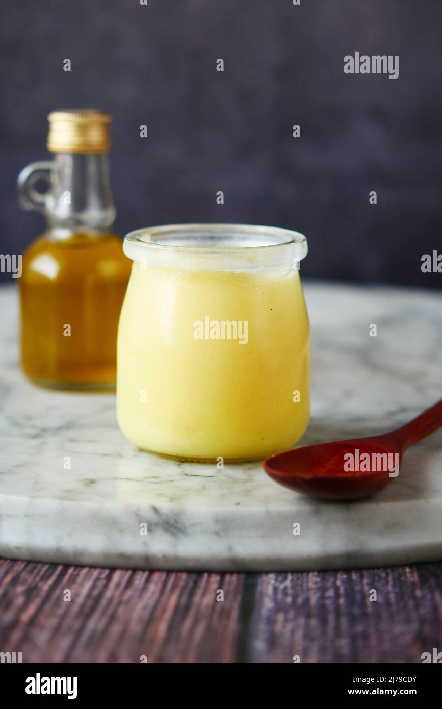 homemade ghee in container on a table Stock Photo Alamy