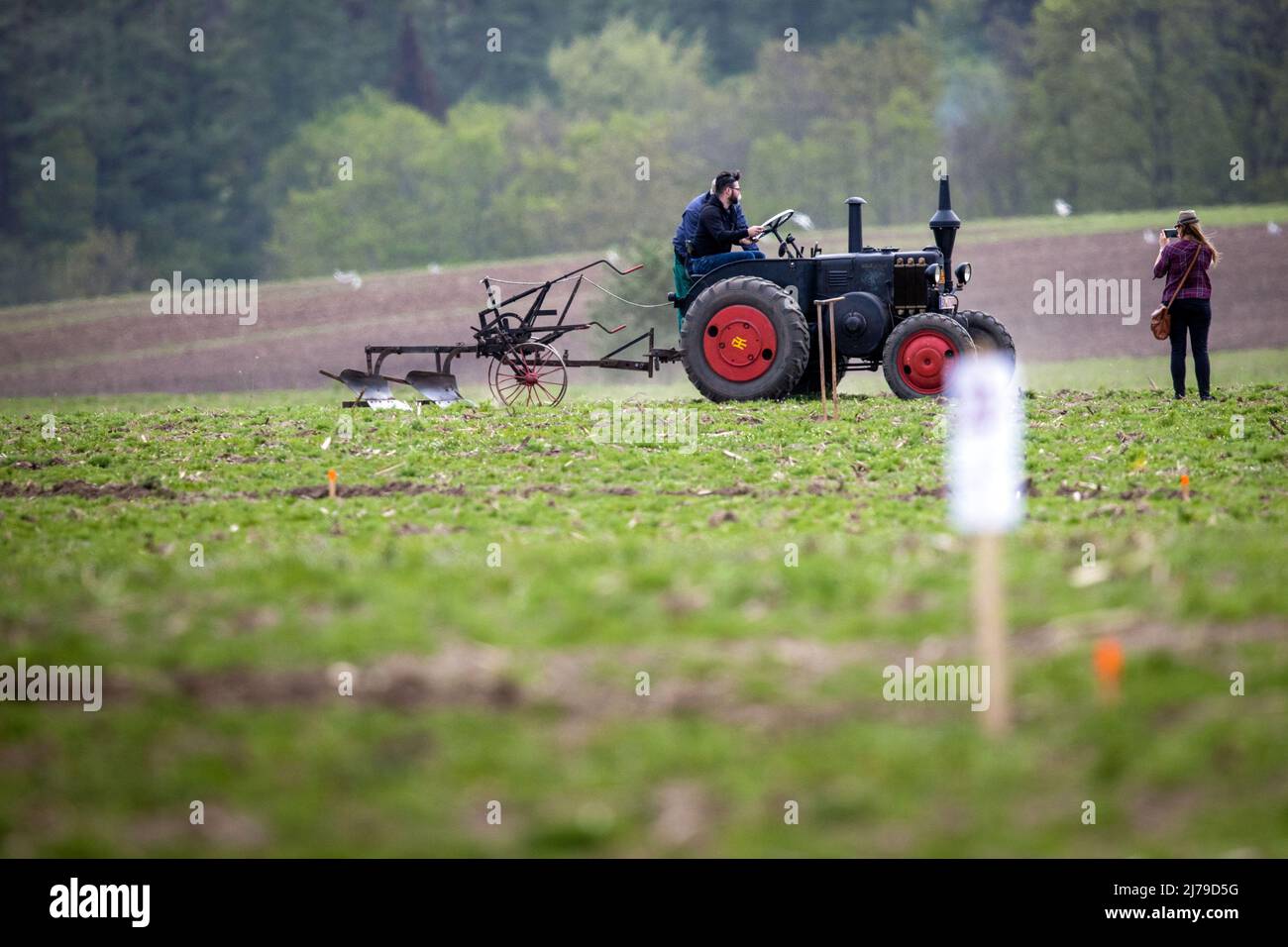 07 May 2022, Mecklenburg-Western Pomerania, Brüsewitz: At the 19th West Mecklenburg Plowing Competition, a Lanz Bulldog built in 1941 drives over the field during the show plowing. The best plowers from the districts of Parchim, Ludwigslust and Northwest Mecklenburg compete with the latest technology in the two disciplines of bed plowing and reversible plowing. Another highlight is the show plowing with historical agricultural technology. Photo: Jens Büttner/dpa Stock Photo