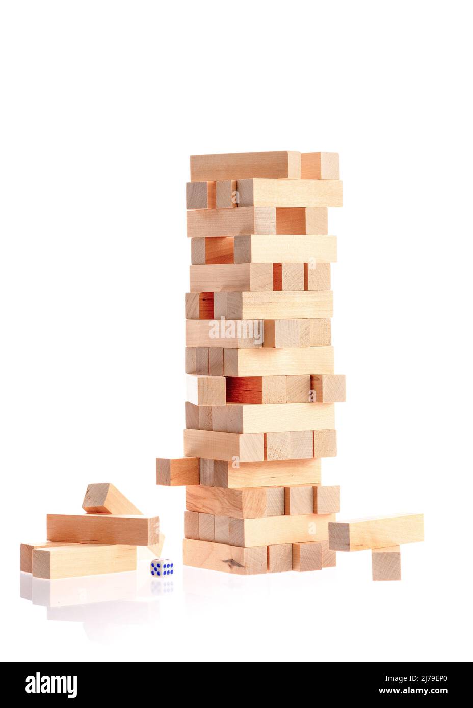 Board game made of wooden blocks. A tower of unevenly shifted wooden