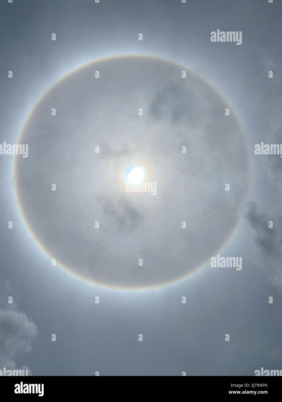 Sun halo from upper atmosphere ice - Grenada, Caribbean, mid-day May 7th 2022 Stock Photo