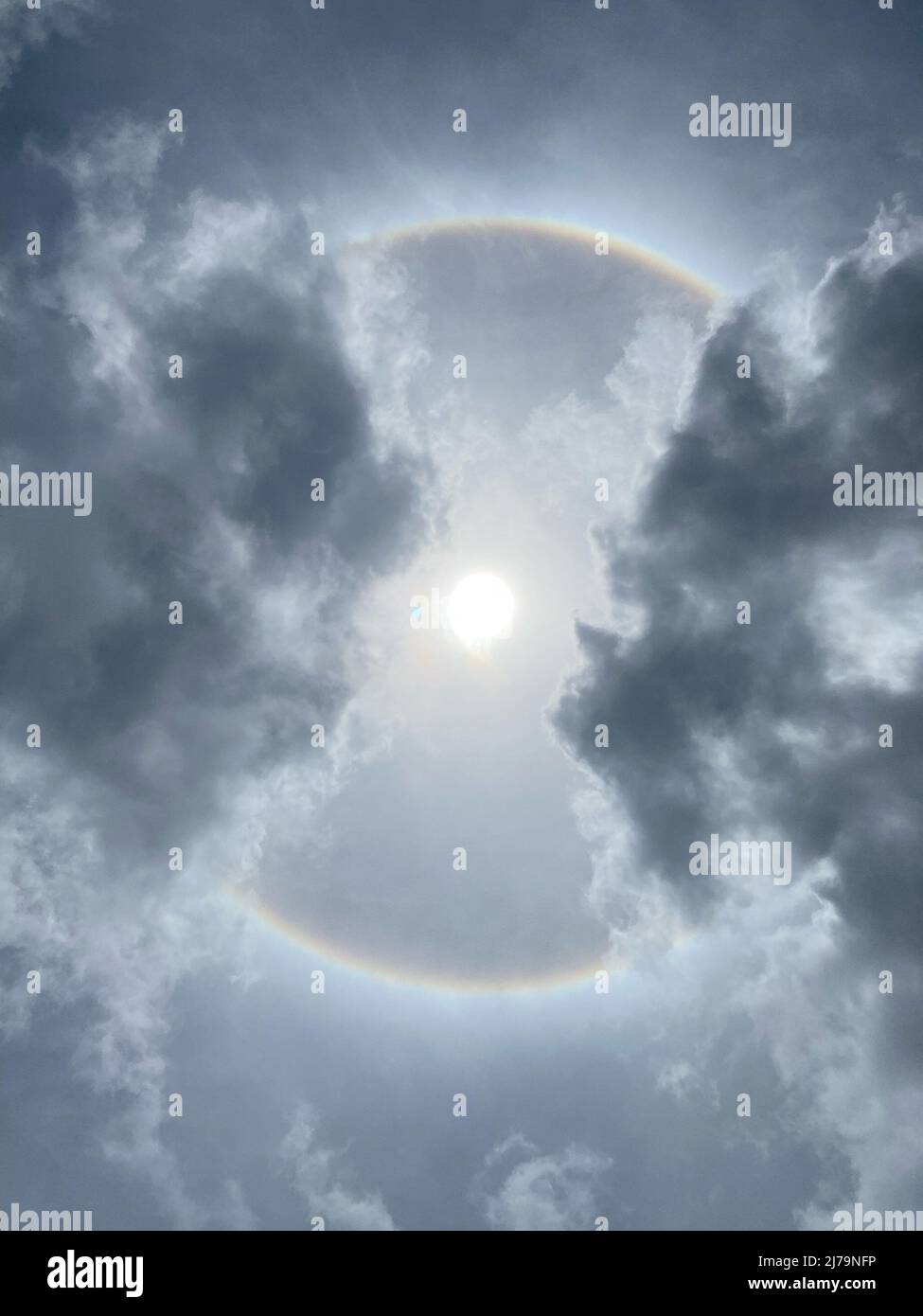 Sun halo from upper atmosphere ice - Grenada, Caribbean, mid-day May 7th 2022 Stock Photo