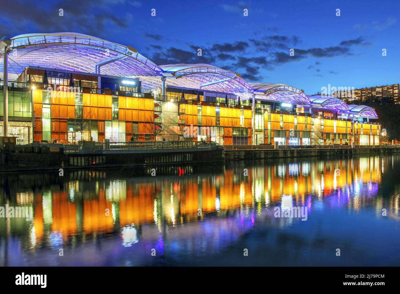 Night scene of Confluence Shopping Mall in the Confluence Perrache district of Lyon, France. The building was opened in 2012 following the plans of ar Stock Photo