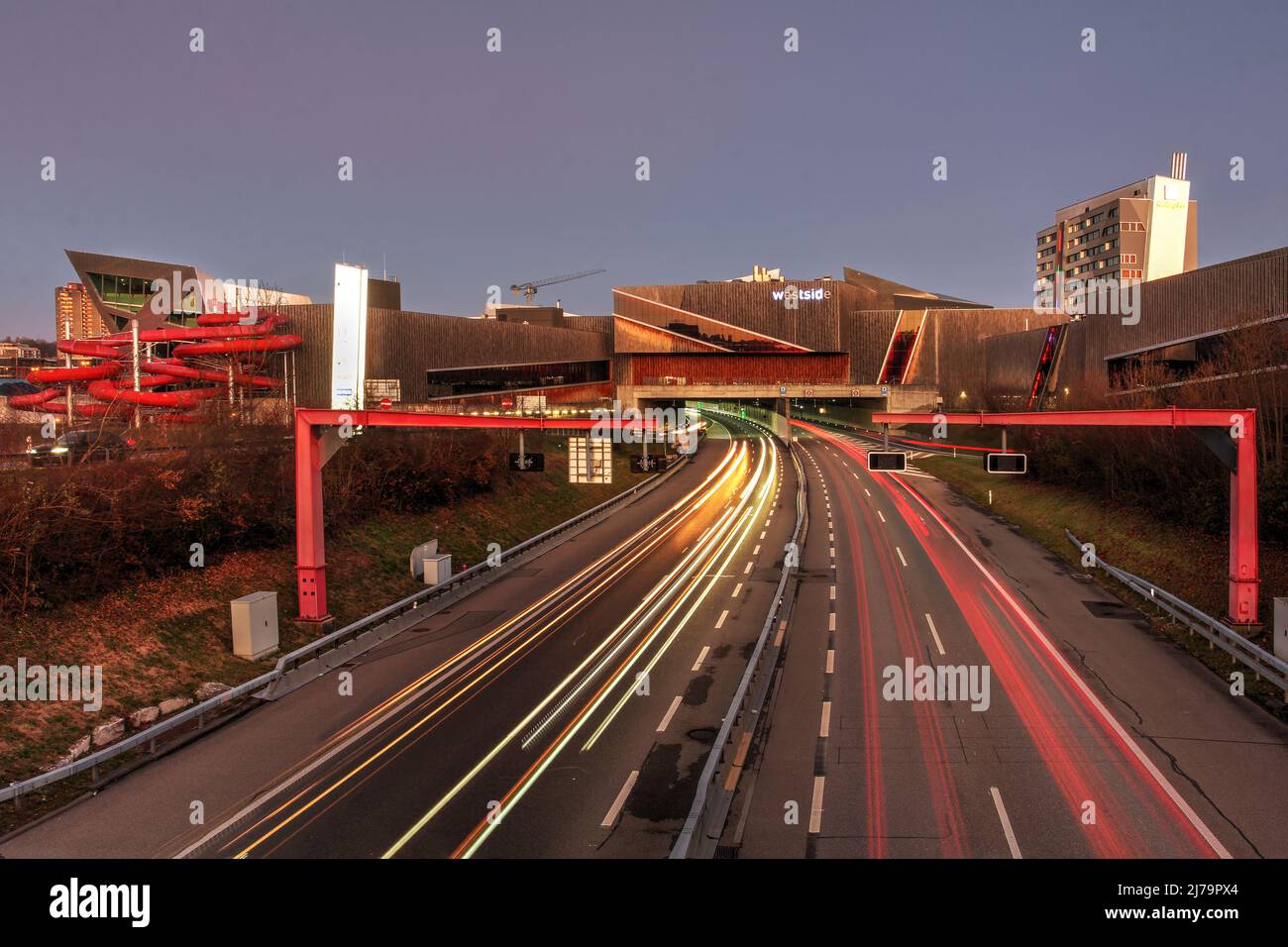 Bern, Switzerland - November 21, 2020 - Westside Shopping and Leisure Centre at night with traffic on A1 motorway before entering swiss capital, Bern. Stock Photo