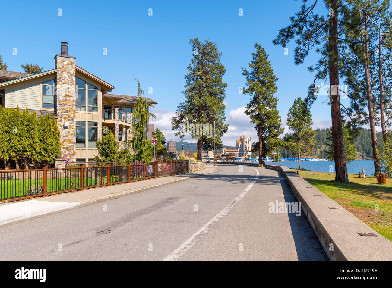 Luxury waterfront homes face the lake with the city beach, park and